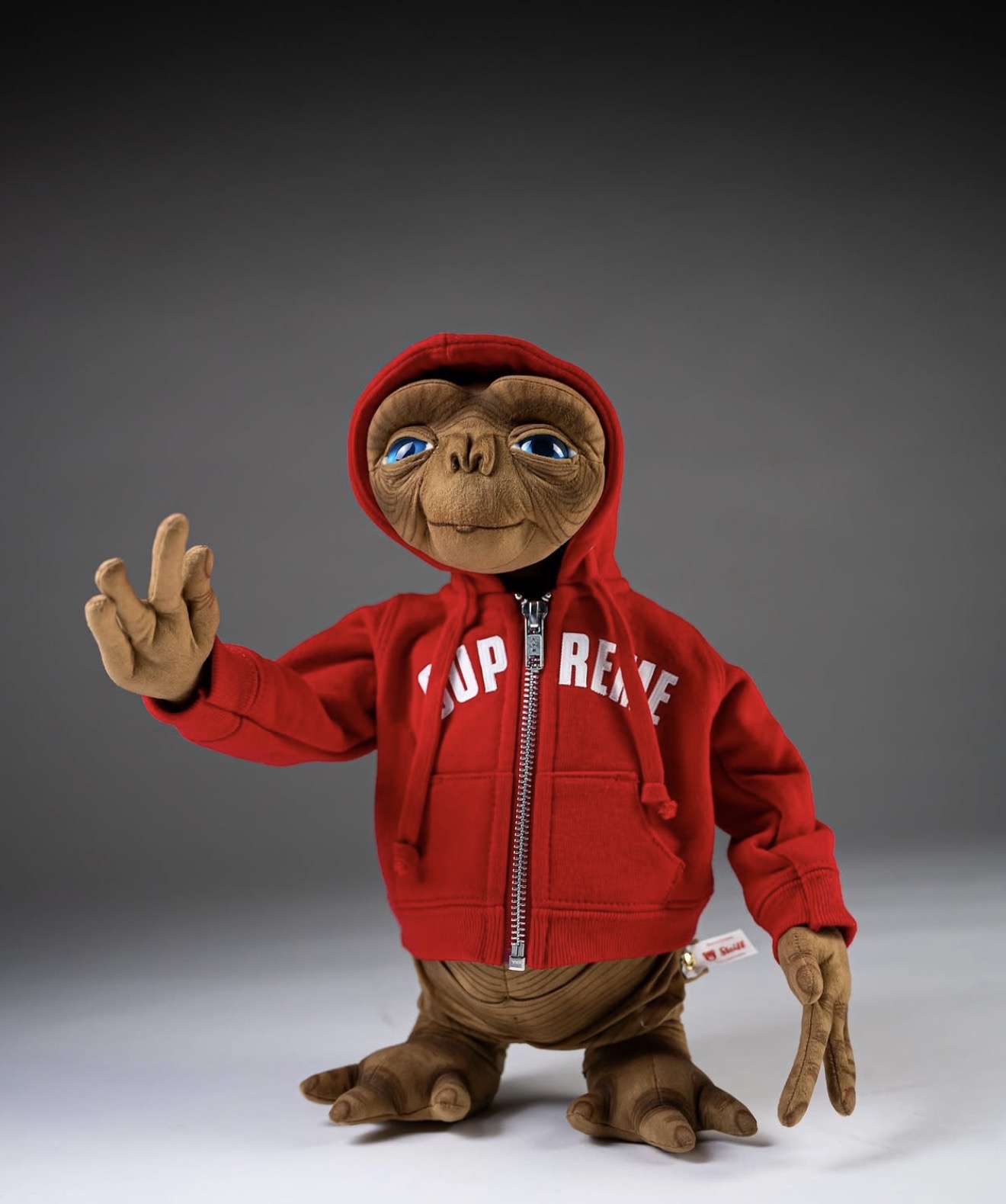 E.T. plush wearing a red Supreme hoodie — Holy Grail collectibles