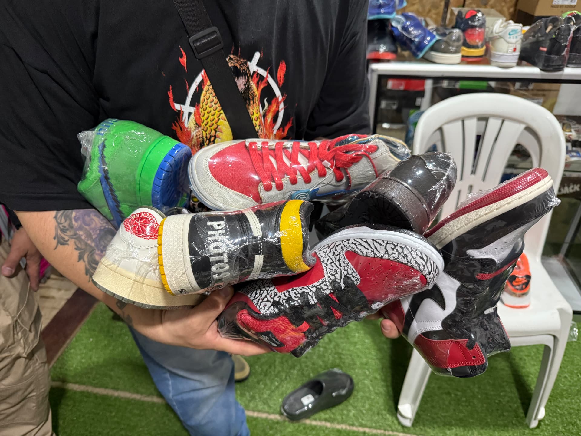 An armful of sneakers at Sneaker Show Colombia